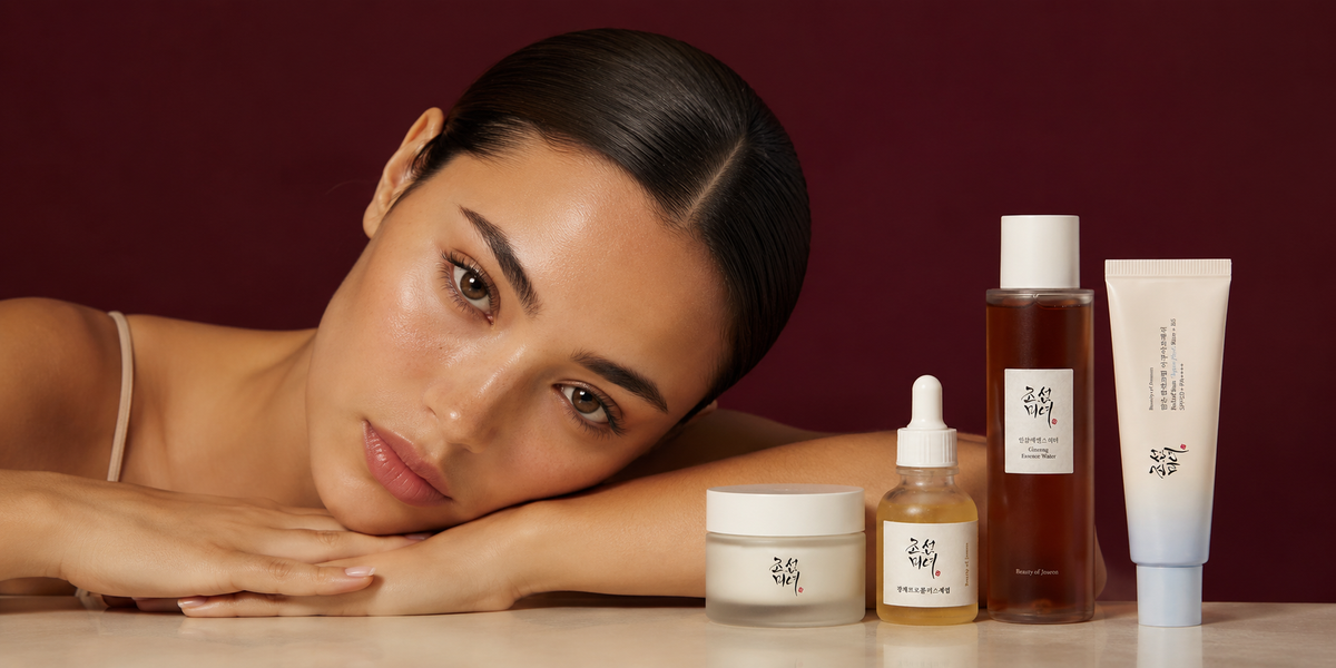 LIORE model with four Korean skincare products on a burgundy background